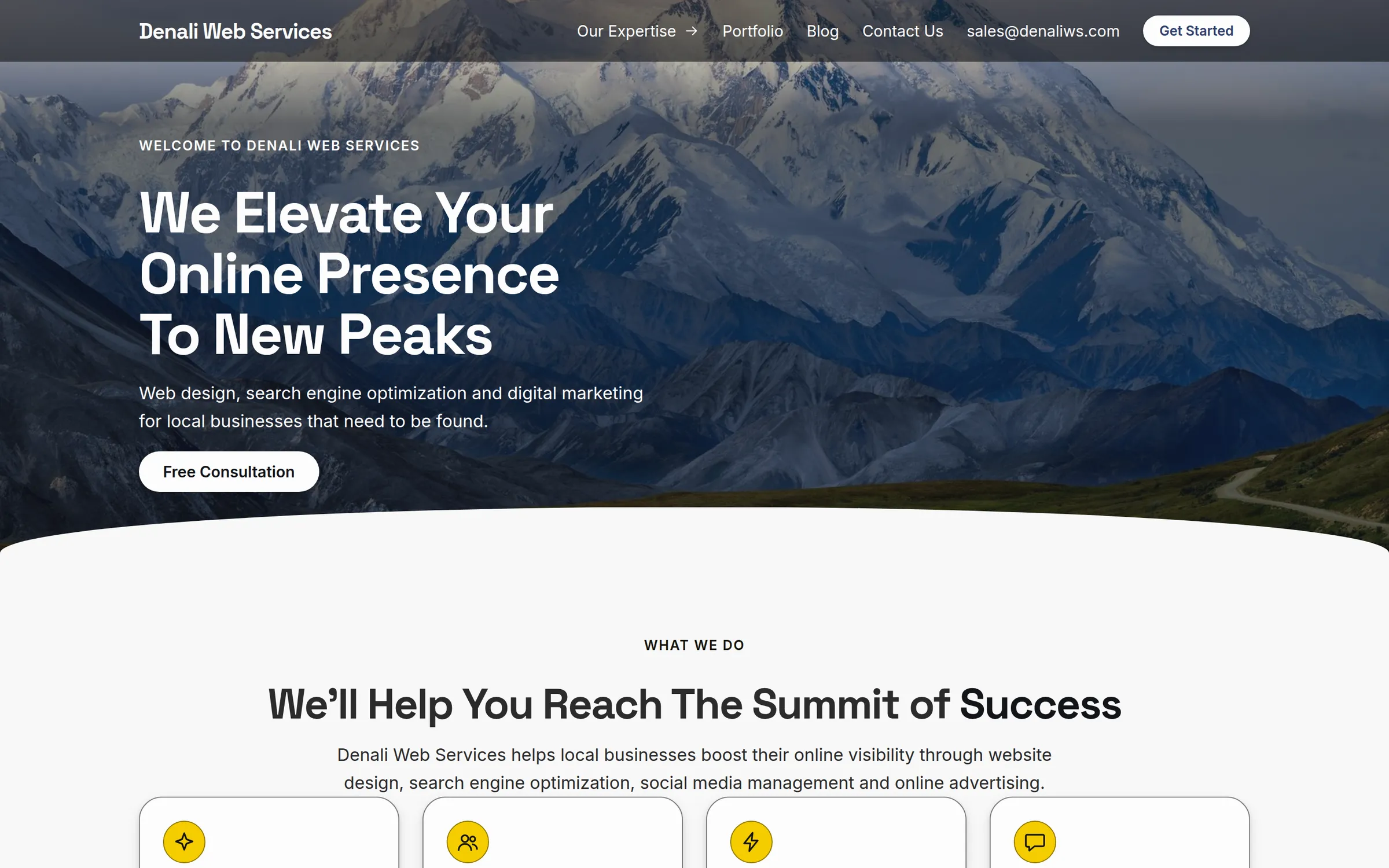 A small-business home page rendered by the platform, a test rebuild of the earlier Denali Web Services site, with a mountain photo behind the headline and a row of service cards below.